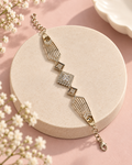 Lumina Crest Bracelet with geometric openwork panels and a sparkling square centrepiece on a soft blush background