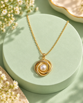Pearl Whirl Necklace on a mint display