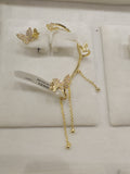 Gold butterfly earrings on a white background