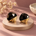 Sable Swirl Earrings with faceted black centres and sculptural gold-tone ridges