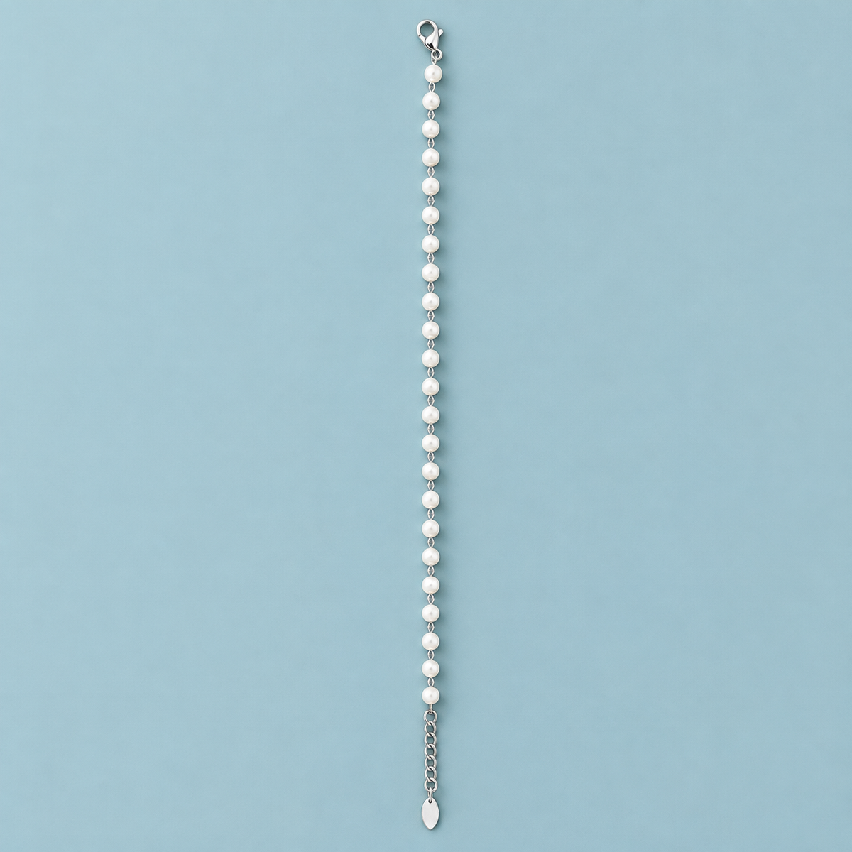Soft Cadence Bracelet with white pearl-like beads and silver-tone links