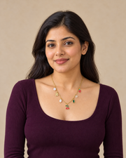 Female model wearing The Charm Diary Necklace with seven charms