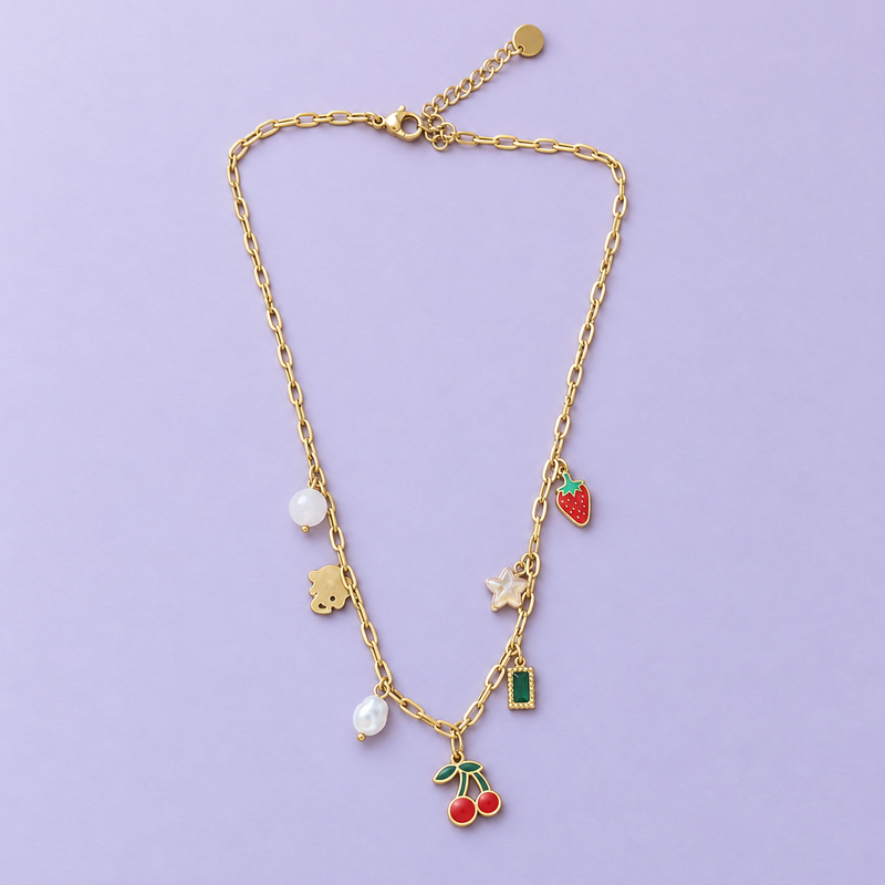 The Charm Diary Necklace with seven assorted charms on a lavender background